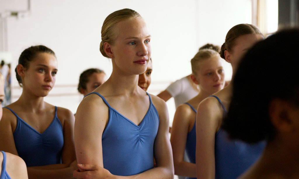 focus on a blonde girl in a girls ballet class