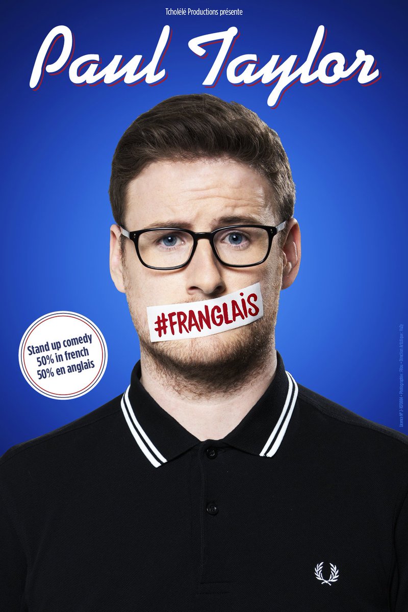 man in glasses and black shirt has tape over his mouth that reads "franglais"